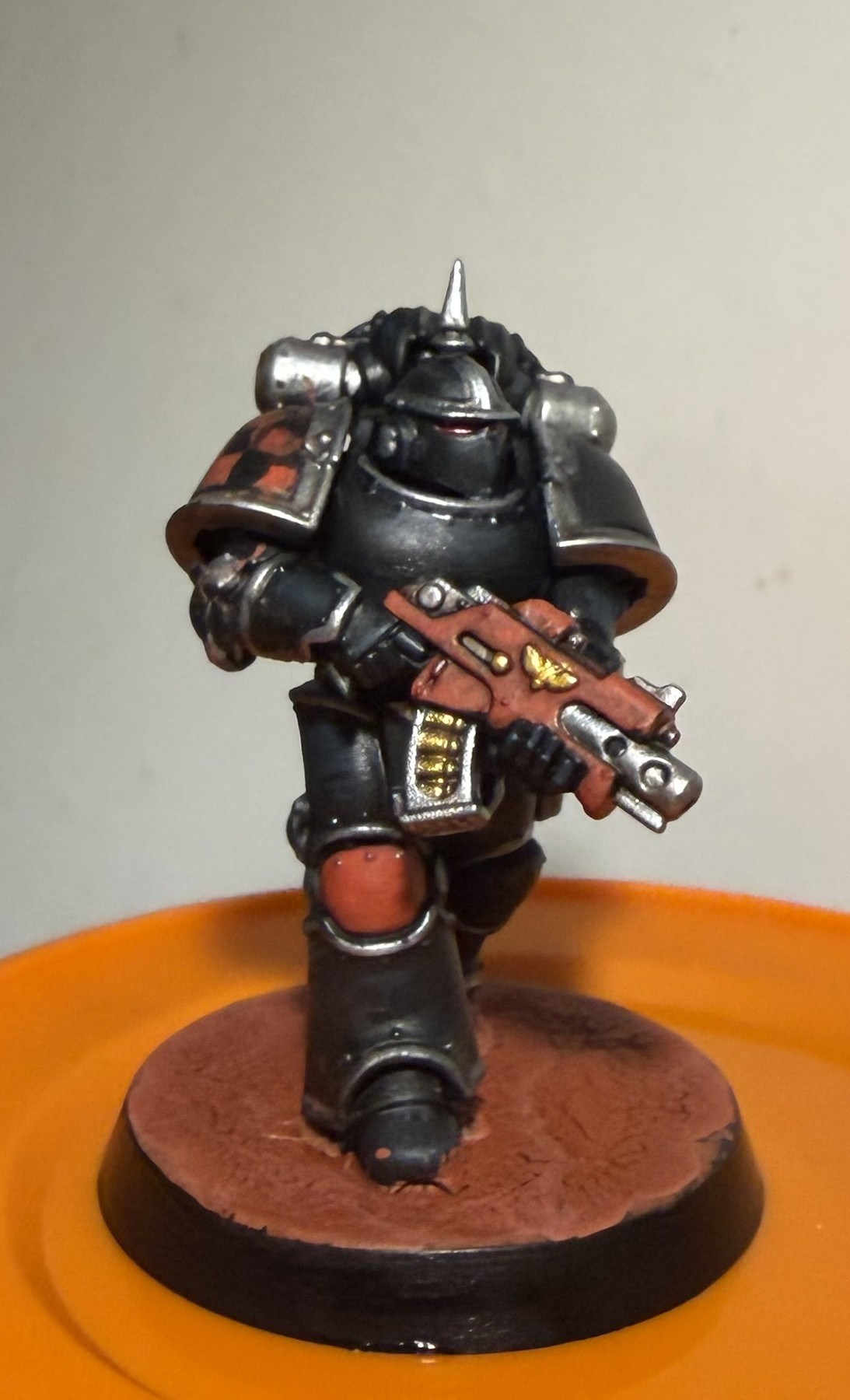 Finished Dark Angels Horus Heresy Mk III miniature with black armour and a red earth base